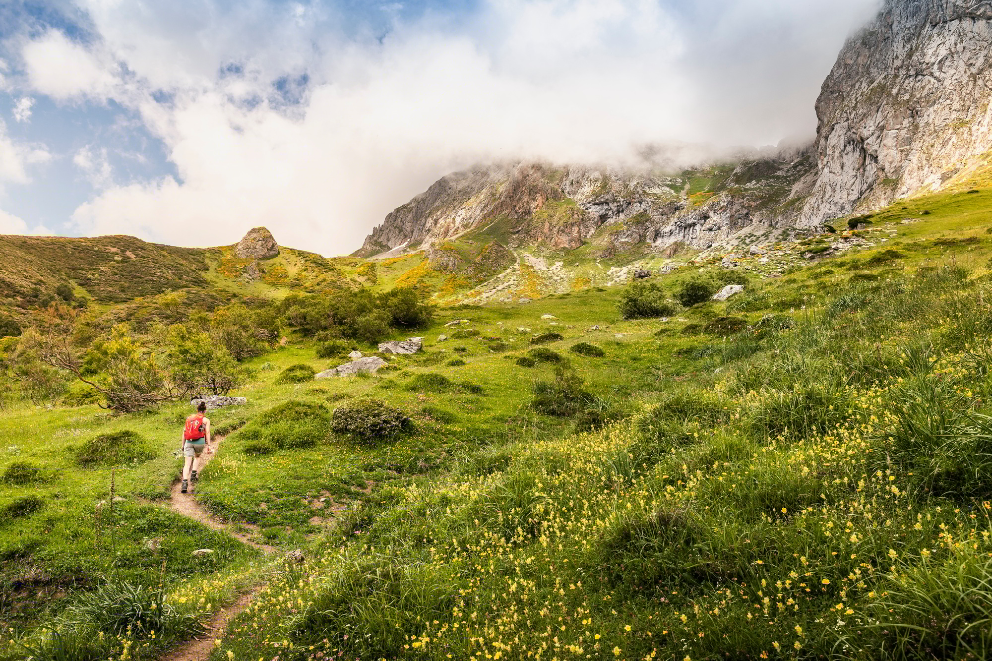 Hiker near Fuente De in national reserve Parque National de los Picos de Europa, Potes, Cantabria,